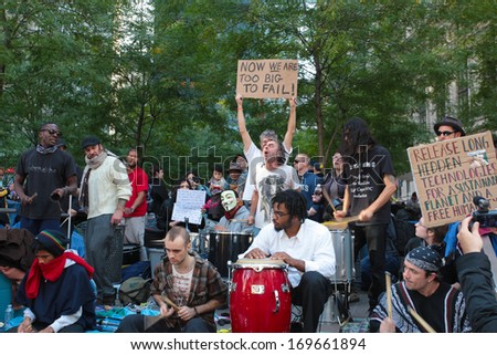 NEW YORK CITY - OCTOBER 11 2011: Drum circle performs as Occupy Wall Street activists camped at Zuccotti Park from September 17 2011 to November 14 2011 when evicted by the NYPD