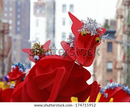 NEW YORK CITY - FEBRUARY 2 2014: Chinese Lunar New Year, the Year of the Horse, was celebrated by a parade in Manhattan\'s Chinatown. Stylized red horse awaiting entry into parade
