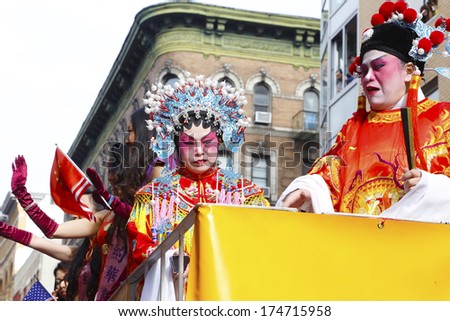 NEW YORK CITY - FEBRUARY 2 2014: Chinese Lunar New Year, the Year of the Horse, was celebrated by a parade in Manhattan\'s Chinatown. Women in vintage courtly attire ride along Mott Street