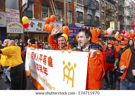NEW YORK CITY - FEBRUARY 2 2014: Chinese Lunar New Year, the Year of the Horse, was celebrated by a parade in Manhattan\'s Chinatown. Asian-American gay & lesbian outreach marching along Mott Street