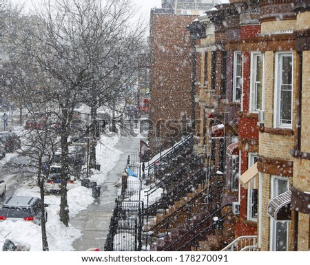 Brownstone Brooklyn/Row houses in Sunset Park district of Brooklyn with snow falling