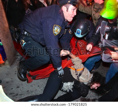 NEW YORK CITY, USA - DECEMBER 17 2011: Occupy Wall Street, protesting financial malfeasance, marked its 90 day anniversary with marches in Manhattan.  NYPD arresting protestors in Midtown Manhattan.