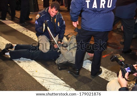NEW YORK CITY, USA - DECEMBER 17 2011: Occupy Wall Street, protesting financial malfeasance, marked its 90 day anniversary with marches in Manhattan. NYPD TARU arresting protestors in Midtown Manhattan
