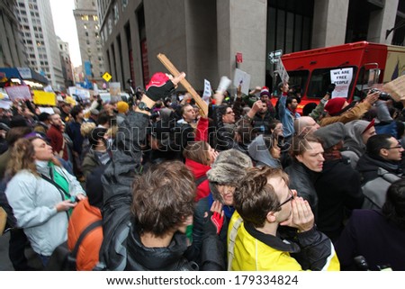 NEW YORK CITY - NOVEMBER 17 2011: Occupy Wall Street, a popular movement opposed to malfeasance on Wall Street, protested expulsion from Zuccotti Park with marches all over NYC. Filling Wall Street