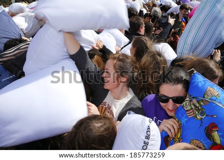 NEW YORK CITY - APRIL 5 2014: the first Saturday of April is International Pillow Fight Day, observed this time at Washington Square Park in Lower Manhattan. Array of combatants in sea of pillows