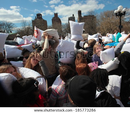 NEW YORK CITY - APRIL 5 2014: the first Saturday of April is International Pillow Fight Day, observed this time at Washington Square Park in Lower Manhattan. Array of pillows held aloft prior to start