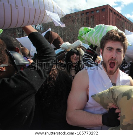 NEW YORK CITY - APRIL 5 2014: the first Saturday of April is International Pillow Fight Day, observed this time at Washington Square Park in Lower Manhattan. Enthusiastic man yelling out