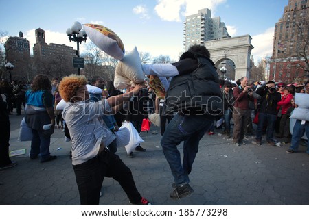 NEW YORK CITY - APRIL 5 2014: the first Saturday of April is International Pillow Fight Day, observed this time at Washington Square Park in Lower Manhattan. Battle in the \