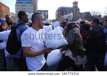 NEW YORK CITY - APRIL 5 2014: the first Saturday of April is International Pillow Fight Day, observed this time at Washington Square Park in Lower Manhattan. Couple go one on one
