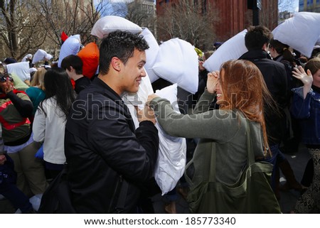 NEW YORK CITY - APRIL 5 2014: the first Saturday of April is International Pillow Fight Day, observed this time at Washington Square Park in Lower Manhattan. Couples prepare to let loose on each other