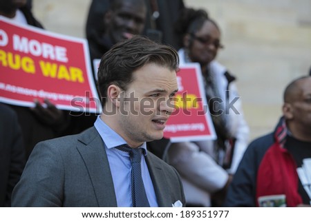 NEW YORK CITY - APRIL 25 2014: Elected officials & activists gathered in front of Brooklyn\'s Borough Hall in support of the DA\'s stance on marijuana arrests. Juvaane Williams aid reads statement