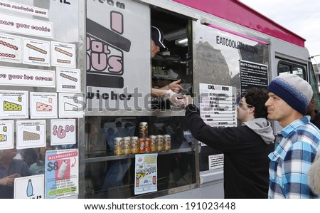 NEW YORK CITY - MAY 4 2014: the Prospect Park Alliance sponsors a bimonthly Food Truck Rally at Grand Army Plaza during spring & summer months. Ice cream sandwich from Coolhaus truck