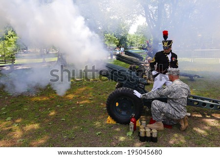 NEW YORK CITY - MAY 26 2014: The 146th annual King's County Memorial Day Parade, one of the nation's oldest, honored fallen & living veterans in the streets of Bay Ridge, Brooklyn. Cannon salute