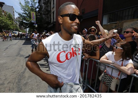 NEW YORK CITY - JUNE 29 2014: Heritage of Pride sponsored the nation\'s largest Gay Pride parade in Manhattan that stretched along Fifth Avenue to Christopher Street. Passing out Diet Coke samples