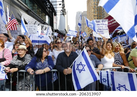 NEW YORK CITY - JULY 20 2014: several thousand supporters of Israeli actions in Gaza staged a rally in Times Square. Israeli flags & signs along 41st Street barrier
