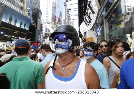 NEW YORK CITY - JULY 20 2014: several thousand supporters of Israeli actions in Gaza staged a rally in Times Square. Man in helmet with face painted blue & white at rally