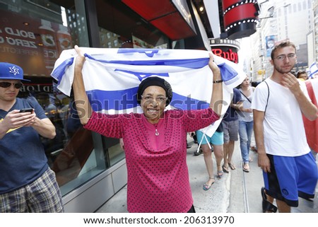 NEW YORK CITY - JULY 20 2014: several thousand supporters of Israeli actions in Gaza staged a rally in Times Square. Orthodox Jewish woman with Israeli flag