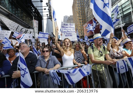 NEW YORK CITY - JULY 20 2014: several thousand supporters of Israeli actions in Gaza staged a rally in Times Square. Waving Israeli flags at 41st Street barrier
