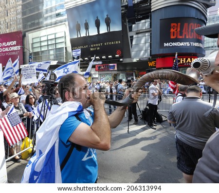 NEW YORK CITY - JULY 20 2014: several thousand supporters of Israeli actions in Gaza staged a rally in Times Square. Christian Palestinian Israel supporter blows shofar with Times Square background