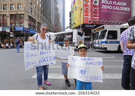 NEW YORK CITY - JULY 20 2014: several thousand supporters of Israeli actions in Gaza staged a rally in Times Square. Family attending rally with hand-lettered signs