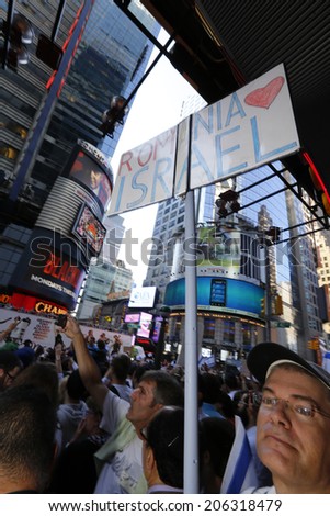 NEW YORK CITY - JULY 20 2014: Several thousand attended a rally in Times Square to support Israel\'s recent actions in Gaza. Roumainian Israel supporter with sign