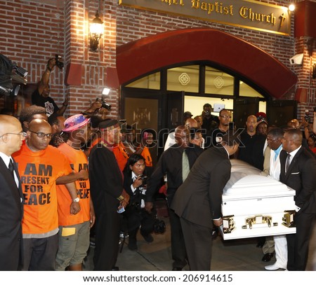 NEW YORK CITY - JULY 23 2014: Funeral services for Eric Garner, the Staten Island resident who died while being taken into custody by NYPD.  Eric Garner\'s coffin emerges from Bethel Baptist Church