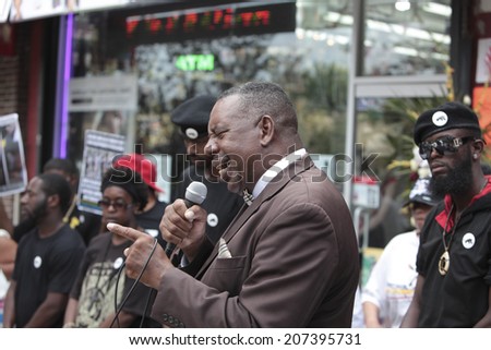 NEW YORK CITY - JULY 27 2014: Black Lawyers for Justice & the New Black Panther Party staged a rally in Staten Island calling for a federal investigation into Eric Garner\'s death at the hands of NYPD