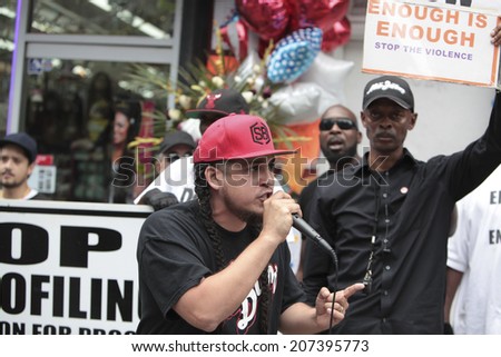 NEW YORK CITY - JULY 27 2014: Black Lawyers for Justice & the New Black Panther Party staged a rally in Staten Island calling for a federal investigation into Eric Garner's death at the hands of NYPD
