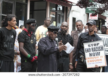 NEW YORK CITY - JULY 26 2014: Black Lawyers for Justice & the New Black Panther Party staged a rally in Staten Island on behalf of Eric Garner who died after a scuffle with NYPD officers