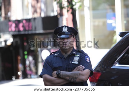 NEW YORK CITY - JULY 28 2014: NYPD personnel including Commissioner William Bratton investigate a shooting in the West Village that left one detective & two US marshals wounded & the suspect dead.