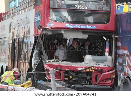 NEW YORK CITY - AUGUST 5 2014: a Gray Line double-decker tour bus collided with another tour bus in Times Square before smashing into a light pole on Duffy Square. 15 were injured; 3 seriously.