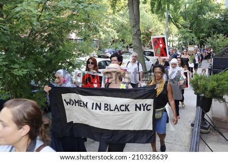 NEW YORK CITY - AUGUST 10 2014: Remembrance for Gaza was held with a rally in Barclays Center, Brooklyn, followed by a silent march into Fort Greene culminating at the Church of St. Luke & St. Matthew