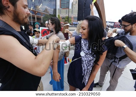 NEW YORK CITY - AUGUST 10 2014: a Remembrance for Gaza was held with a rally in Barclay\'s Center Brooklyn followed by a silent march through Fort Greene to the church of St Luke & St Matthew