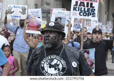 NEW YORK CITY - AUGUST 18 2014: Peoples Power Assembly staged an emergency rally at 1 Police Plaza before marching to City Hall seeking justice for Eric Garner, Michael Brown & others killed by police