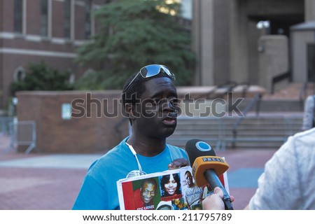 NEW YORK CITY - AUGUST 18 2014: Peoples Power Assembly staged an emergency rally at 1 Police Plaza before marching to City Hall seeking justice for Eric Garner, Michael Brown & others killed by police