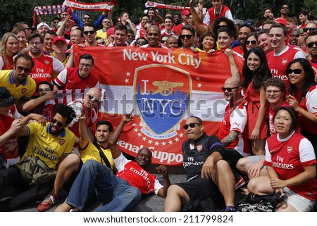 NEW YORK CITY - AUGUST 16 2014: Arsenal NYC Football Club supporters held a rally & photo shoot to celebrate their team\'s winning season in Union Square Park