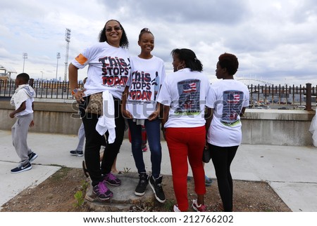 NEW YORK CITY - AUGUST 23 2014: thousands rallied in Staten Island demanding justice & accountability in the deaths of Eric Garner, Michael Brown & other victims of alleged police brutality