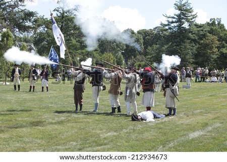 NEW YORK CITY - AUGUST 24 2014: Green-Wood Historic Fund sponsored a reenactment of the Battle of Brooklyn at Greenwood Cemetery, Brooklyn, with demonstrations of musketry, cannon fire & horsemanship