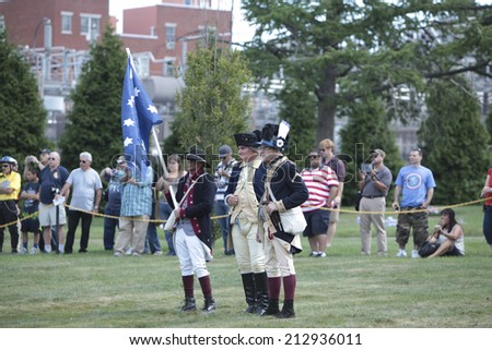 NEW YORK CITY - AUGUST 24 2014: Green-Wood Historic Fund sponsored a reenactment of the Battle of Brooklyn at Greenwood Cemetery, Brooklyn, with demonstrations of musketry, cannon fire & horsemanship