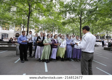 NEW YORK CITY - SEPTEMBER 11 2013: the 13th anniversary of the WTC terror attacks was observed in Lower Manhattan by first responders & relatives of attack victims. Mennonites sing hymns Zuccotti Park