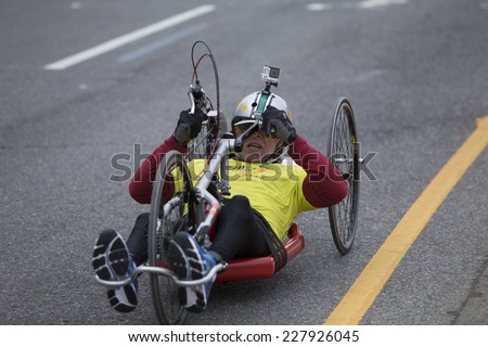 NEW YORK CITY - NOVEMBER 2 2014: the 43rd annual NYC Marathon saw more than 50,000 entrants race through all five boroughs. Wheelchair division competitor passing mile four in Brooklyn