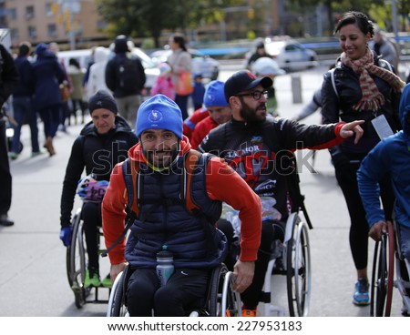 NEW YORK CITY - NOVEMBER 2 2014: the 43rd annual New York City Marathon saw more than 50,000 entrants run through all five boroughs. Wheelchair division finishers exultant after the race