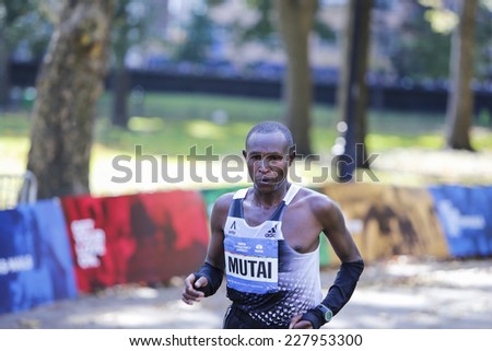 NEW YORK CITY - NOVEMBER 2 2014: the 43rd annual New York City Marathon saw more than 50,000 entrants run through all five boroughs. Men\'s elite runner Geoffrey Mutai enters Central Park