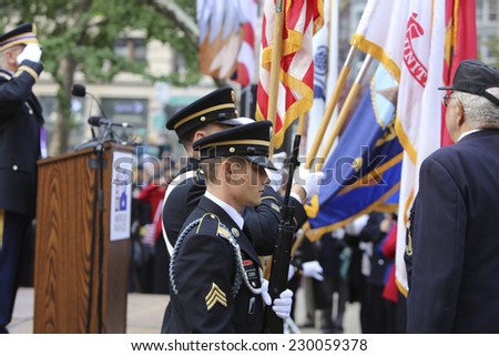 NEW YORK CITY - NOVEMBER 11 2014: the 95th annual Veteran\'s Day parade along Fifth Avenue is the largest Nov 11 celebration in the United States. Color guard at Madison Square Park