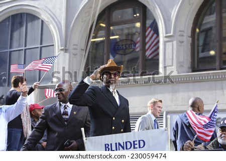 NEW YORK CITY - NOVEMBER 11 2014: the 95th annual Veteran\'s Day parade along Fifth Avenue is the largest Nov 11 celebration in the United States. Blind veterans association members