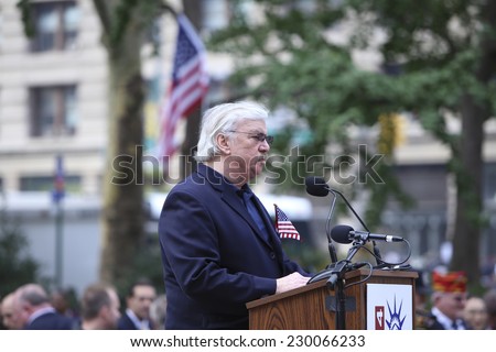 NEW YORK CITY - NOVEMBER 11 2014: the 95th annual Veteran\'s Day parade along Fifth Avenue is the largest Nov 11 celebration in the United States. Veteran\'s Corner host Captain Donald Buzney speaks