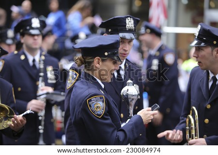NEW YORK CITY - NOVEMBER 11 2014: the 95th annual Veteran\'s Day parade along Fifth Avenue is the largest Nov 11 celebration in the United States. NYPD band leader Amy Pape prior to parade start