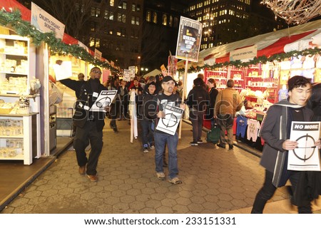 NEW YORK CITY - NOVEMBER 25 2014: several hundred gathered at Union Square to await announcement of the Ferguson grand jury\'s verdict in the death of Michael Brown followed by a march to Times Square
