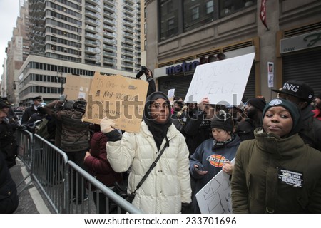 NEW YORK CITY - NOVEMBER 27 2014: Ferguson protesters attempted to block Macy's Thanksgiving Day parade in reaction to the grand jury's failure to indict Darren Wilson. NYPD made several arrests