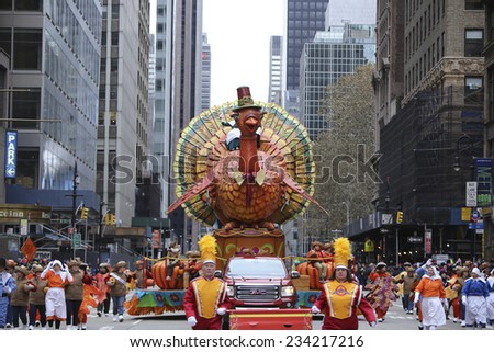 NEW YORK CITY - NOVEMBER 27 2014: the 88th annual Macy\'s Thanksgiving Day parade stretched from Manhattan\'s Upper West Side to Herald Square, viewed by 350,000 spectators. Tom Turkey float